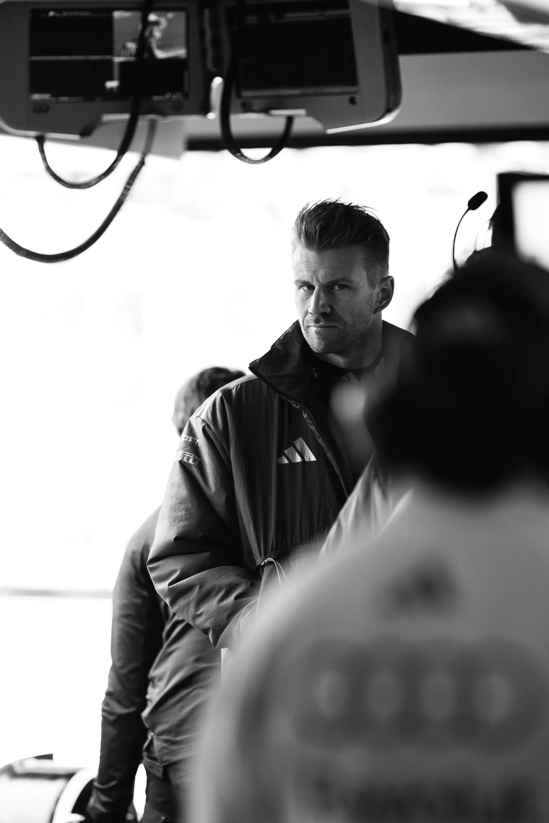 Audi Revolut F1® Team driver Nico Hulkenberg observing the garage activity black and white foto