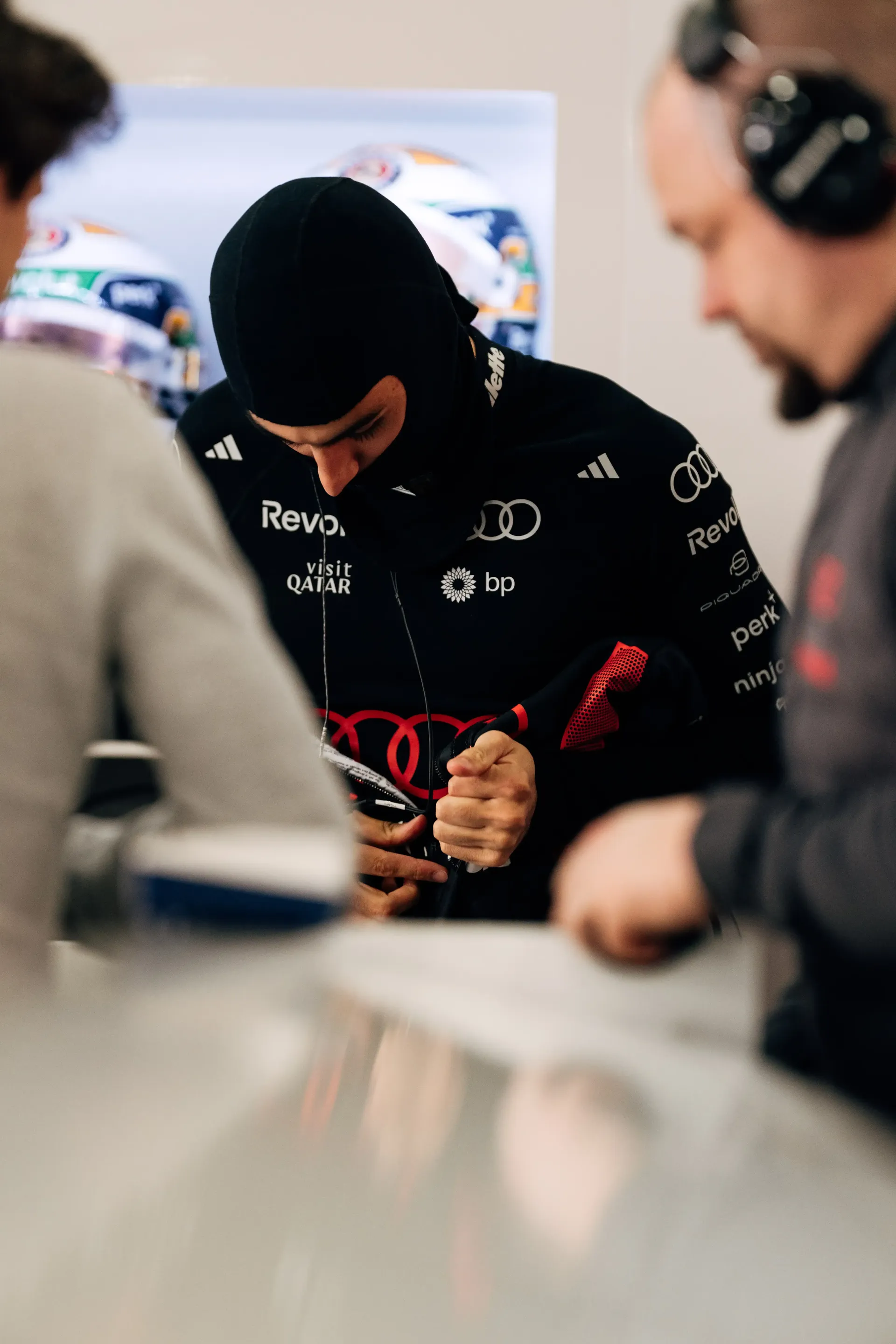 Audi Revolut F1® Team driver Gabriel Bortoleto putting on suit and getting ready for the race