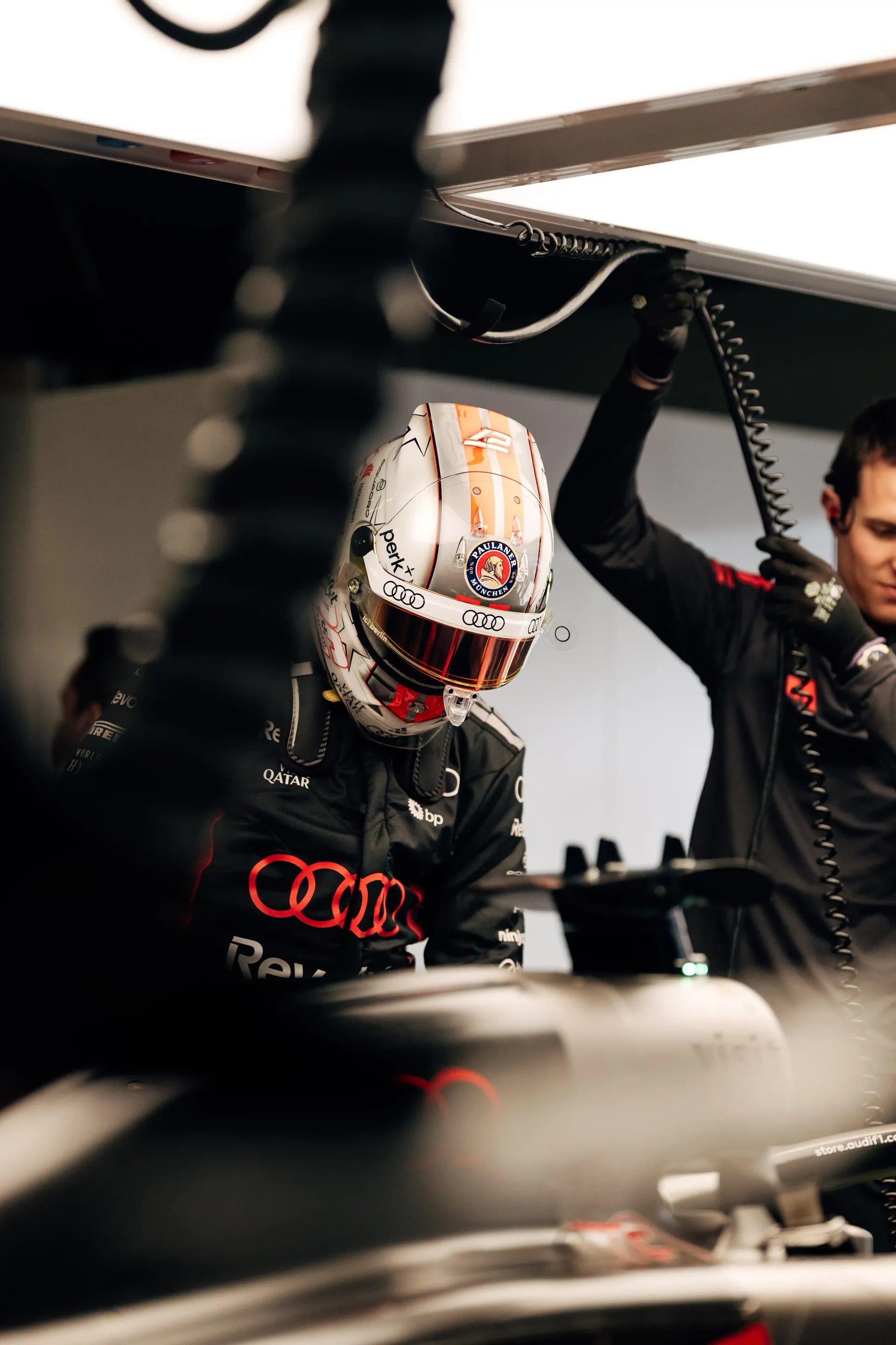 Audi Revolut F1® Team driver Nico Hulkenberg standing along his Formula 1 car