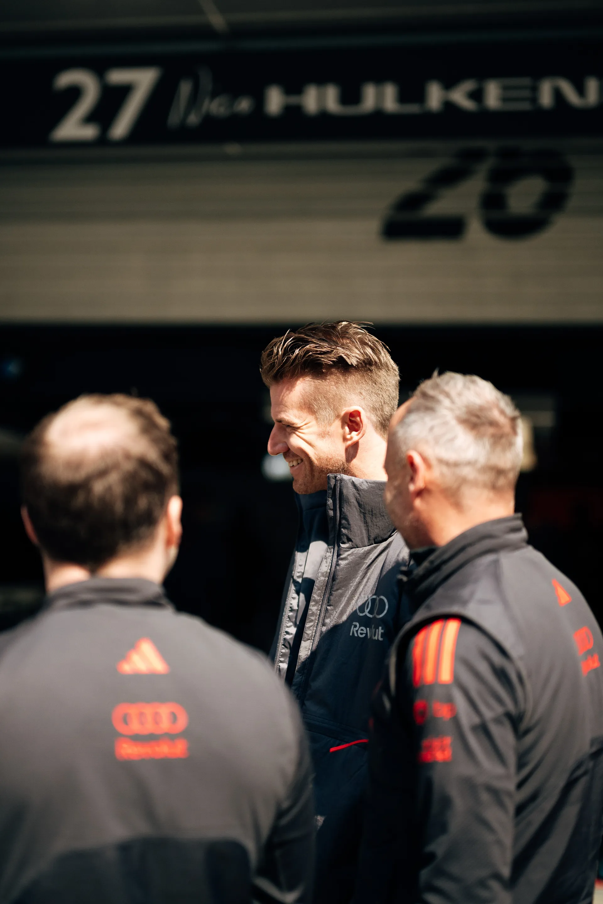 Audi Revolut F1® Team staff gather in the Shanghai paddock during race weekend setup with Nico Hulkenberg.