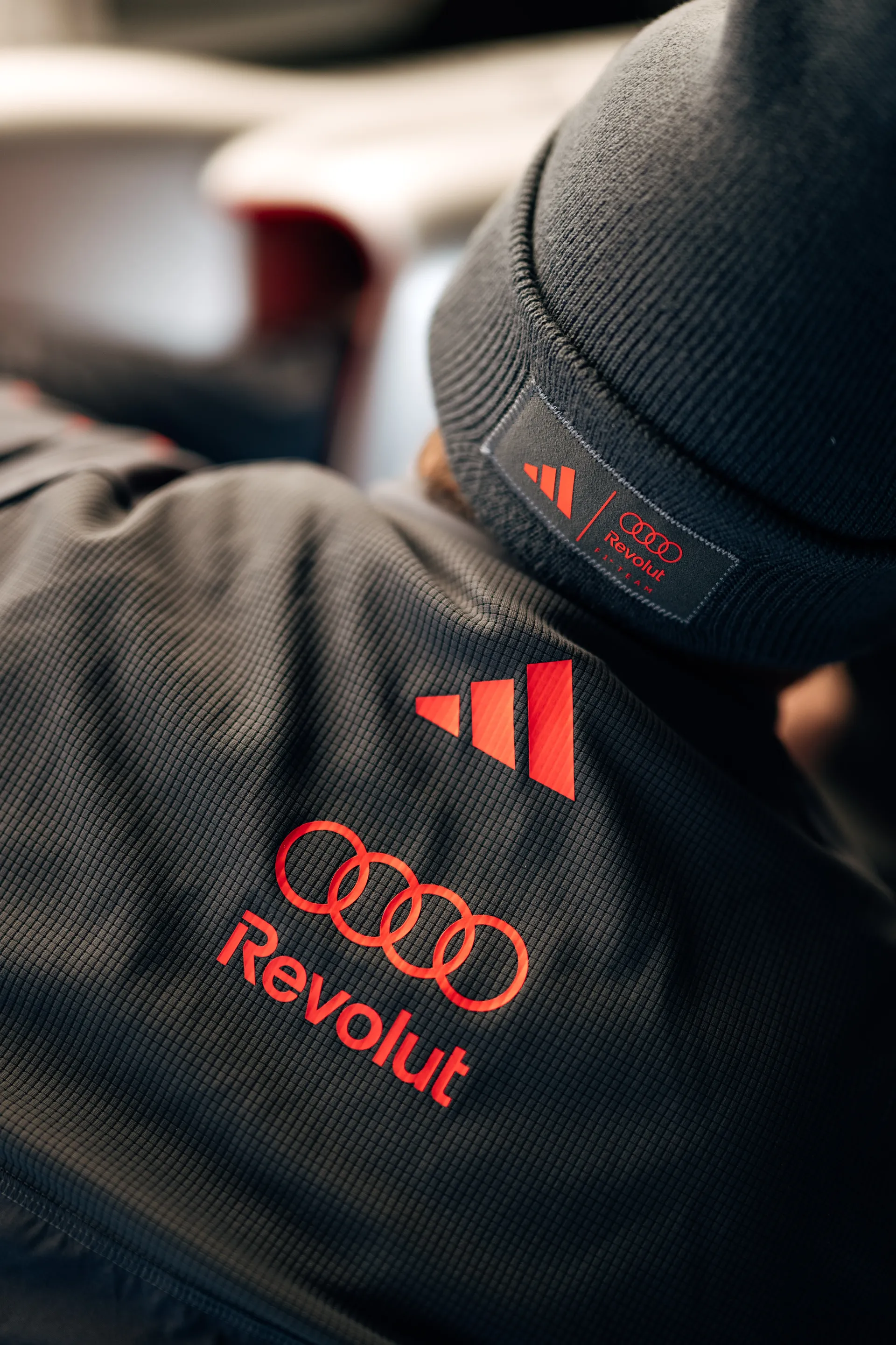 Close up of Audi Revolut F1® Team branding on team apparel during the Chinese Grand Prix weekend.