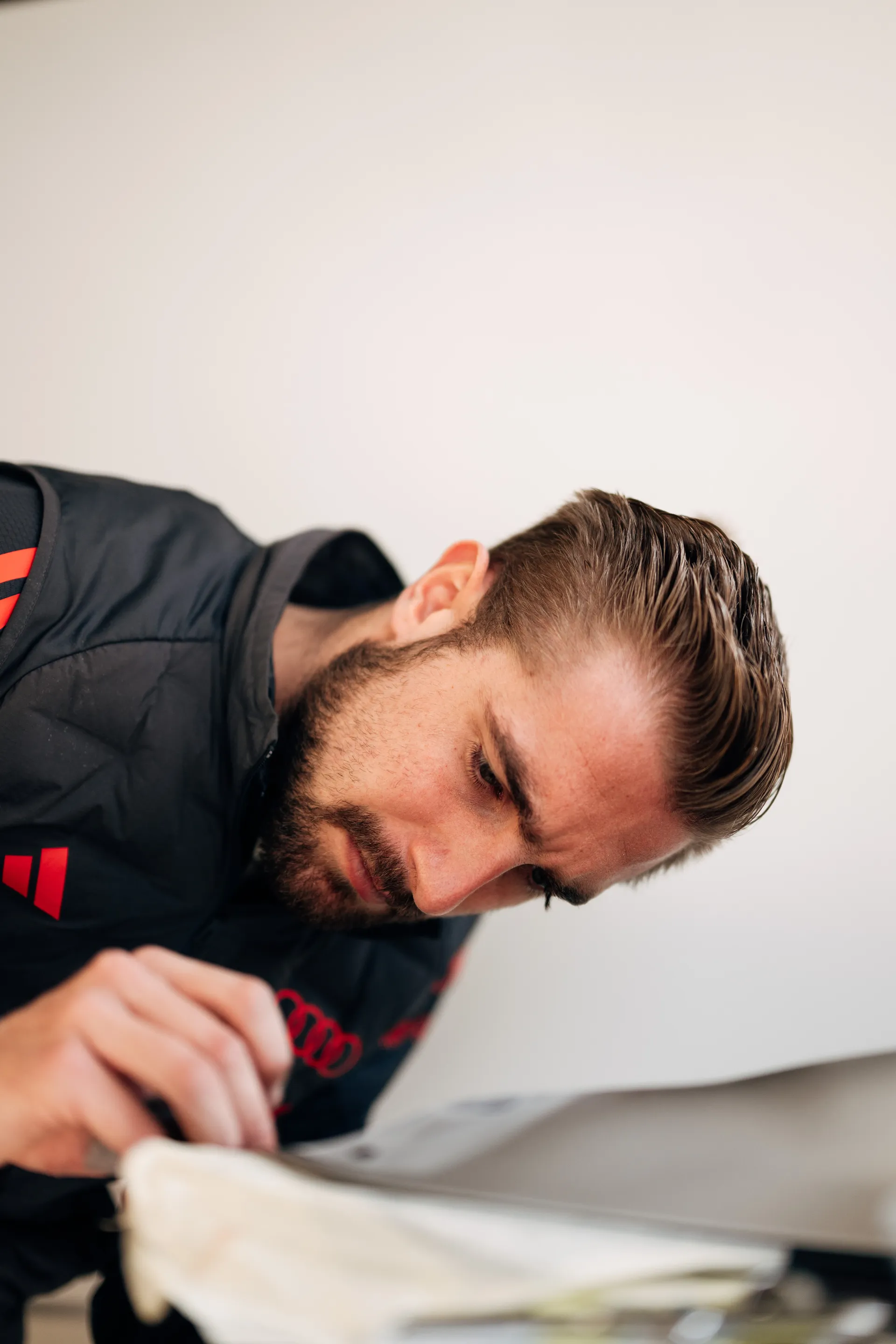 Close up of an Audi Revolut F1® Team member concentrating on detailed work inside the garage in Shanghai.