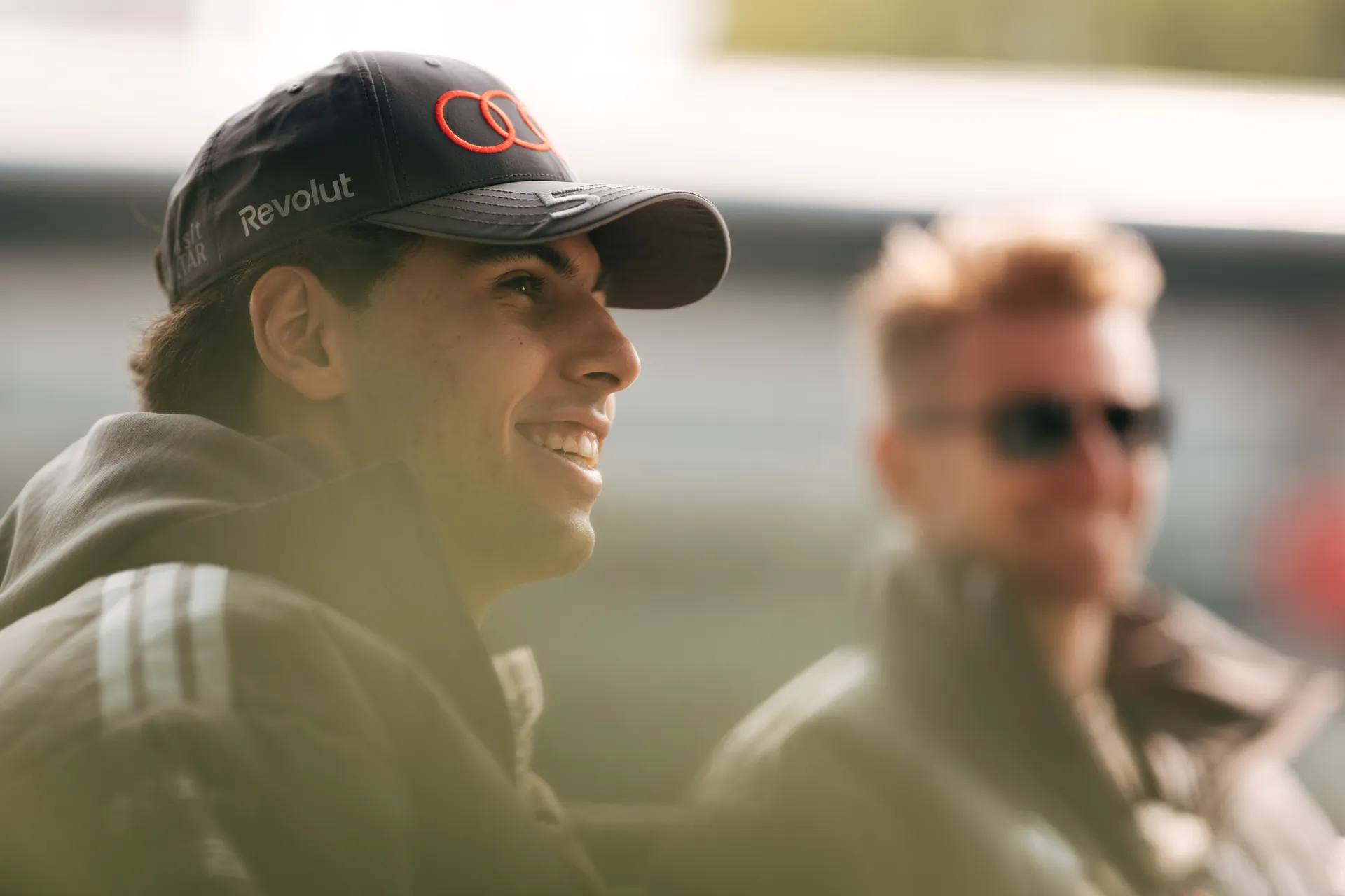 Close up of an Audi Revolut F1® Team driver Gabriel Bortoleto in the Shanghai paddock, smiling during an off track moment.