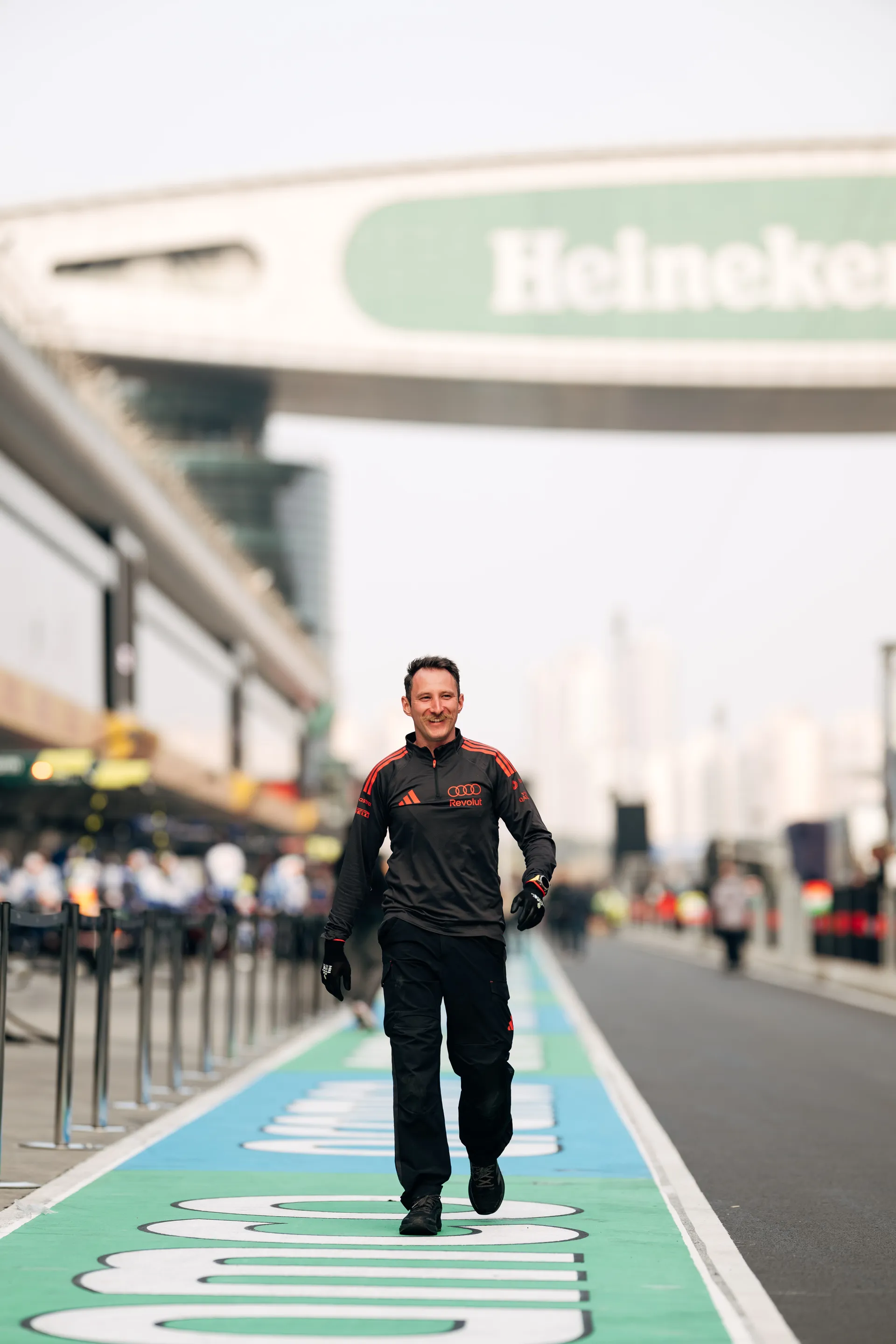 Audi Revolut F1® Team crew member walks through the Shanghai pit lane during race weekend setup.