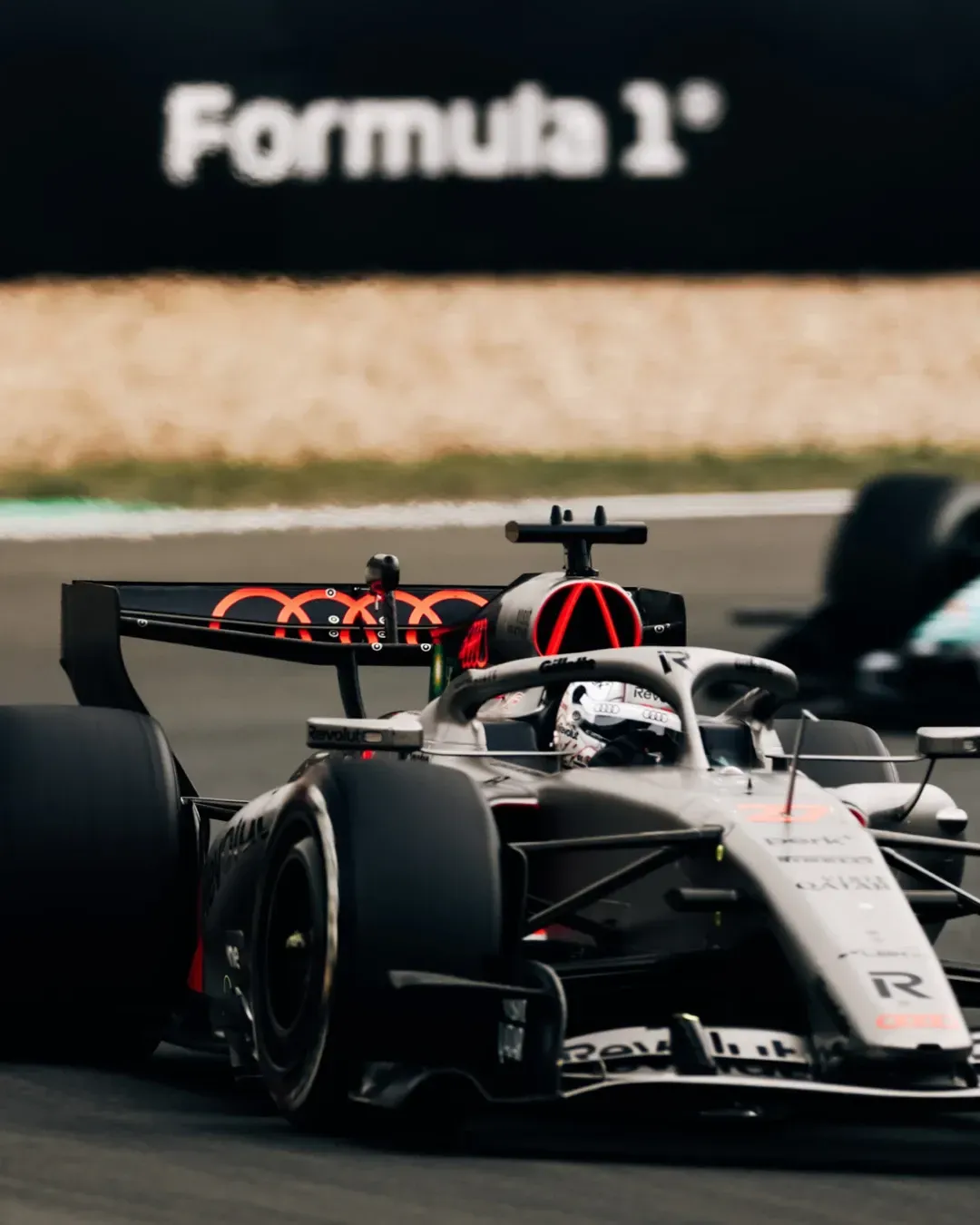 Close up of Nico Hulkenberg in the Audi Revolut F1® Team car on track at the Chinese Grand Prix, captured at speed during the race in Shanghai.