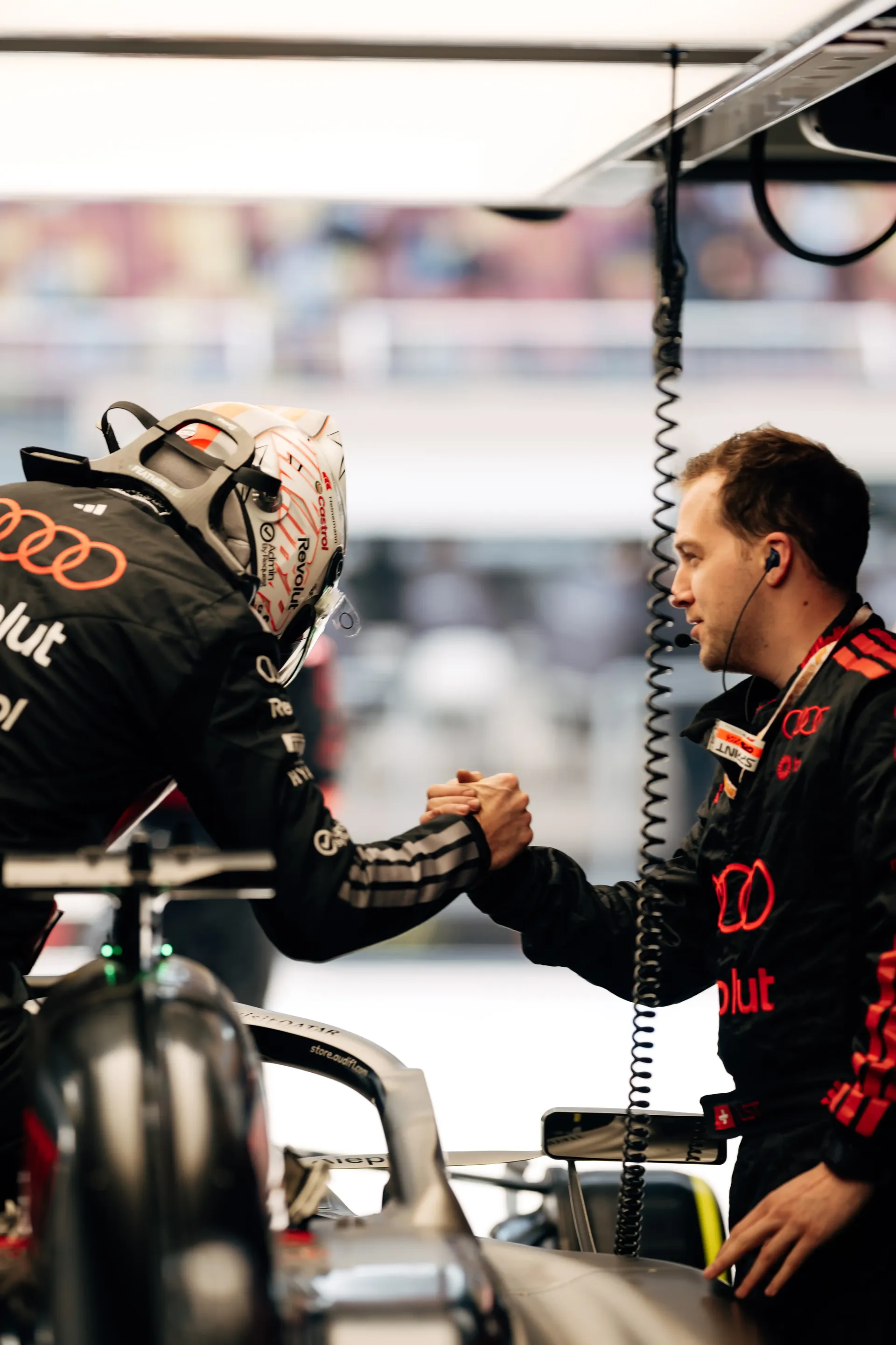 Audi Revolut F1® Team engineers and Nico Hulkenberg  working together inside the Formula 1 garage during the Chinese GP sprint weekend.
