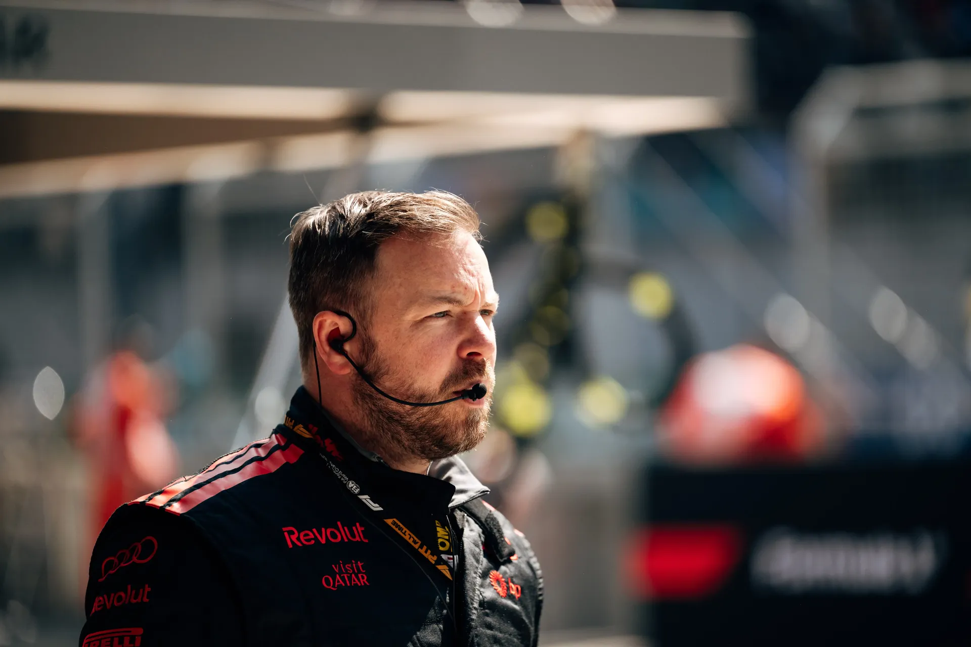 Audi Revolut F1® Team team member standing in the paddock area during the Chinese Grand Prix sprint event.