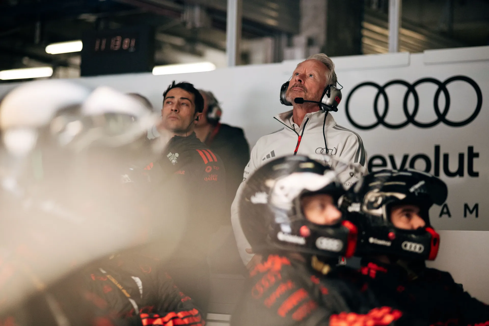 Audi Revolut F1® Team staff and pit crew watching track activity from the garage during the Chinese GP sprint session.