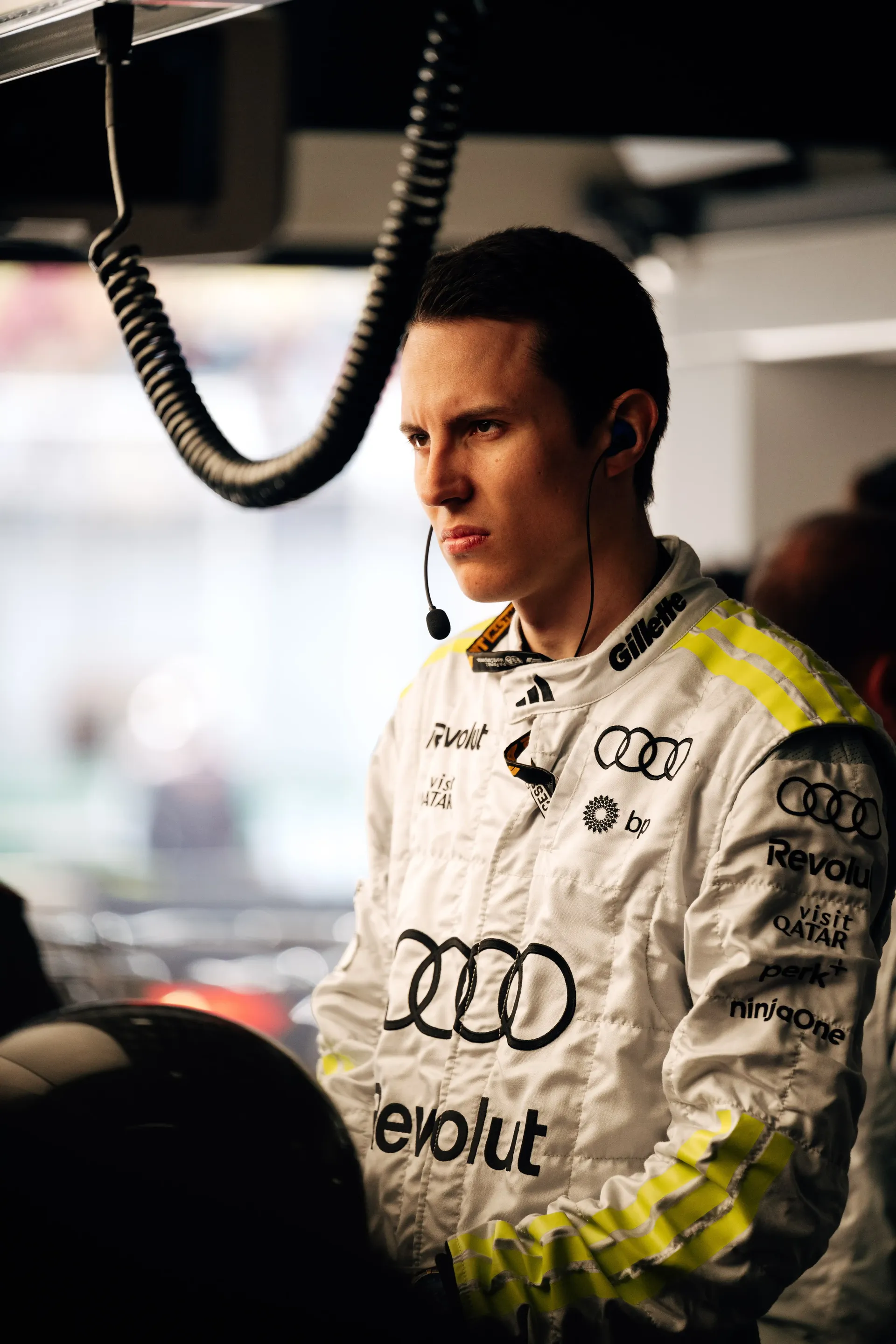 Audi Revolut F1® Team crew member in race suit inside the garage