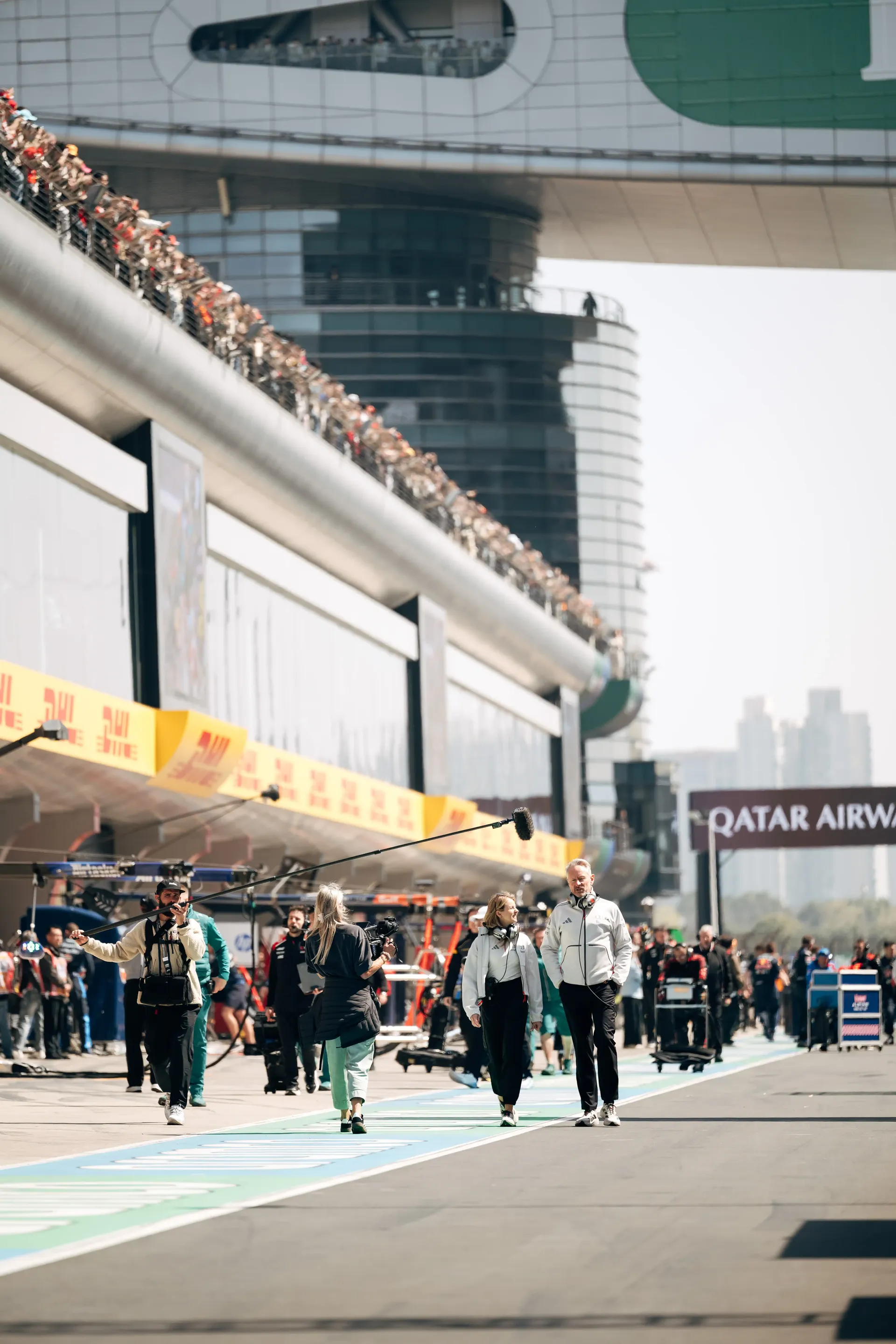 Jonathan Wheatley walking at the Audi Revolut F1® Team paddock and pit lane scene during the Chinese Grand Prix sprint weekend.