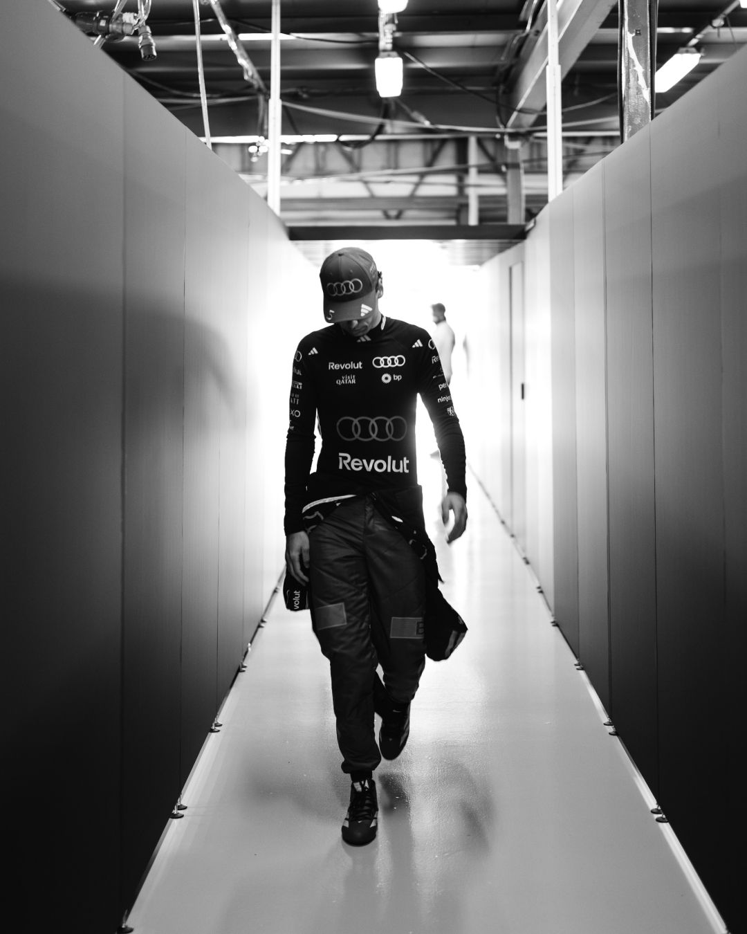 Audi Revolut F1® Team driver Gabriel Bortoleto walks down an isle