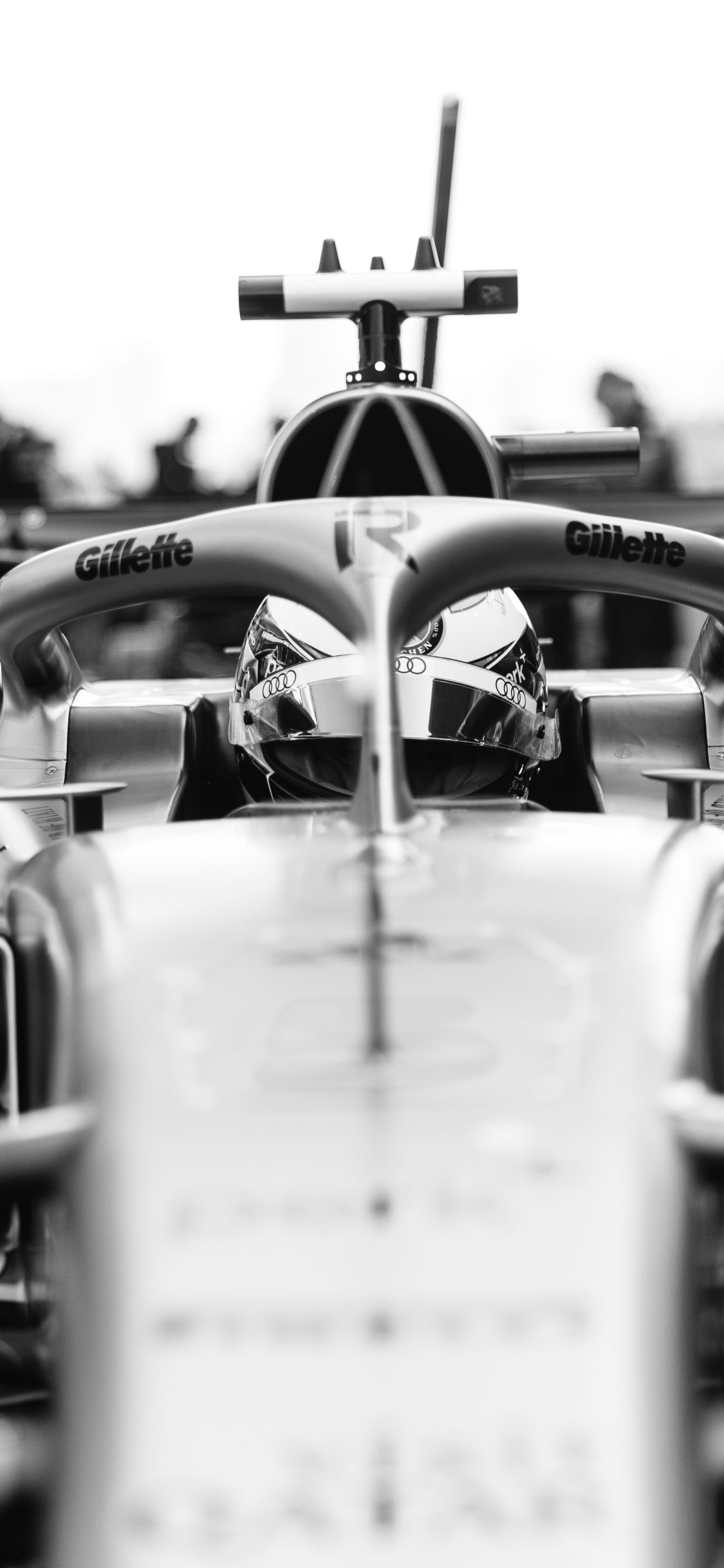 Front view of Nico Hulkenberg seated in the Audi Revolut F1® Team car in a black and white image before the Chinese Grand Prix.