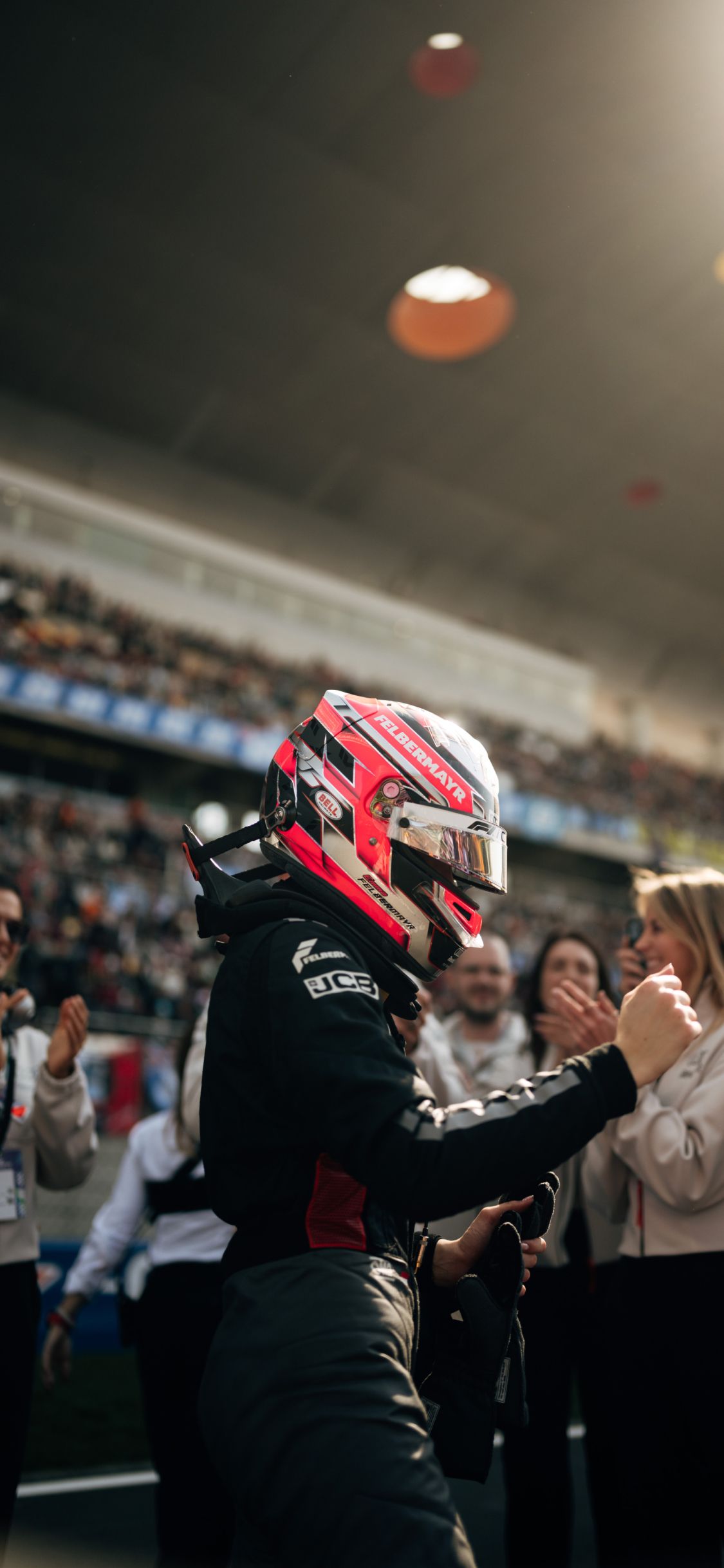 Emma Felbermayr greets Audi Revolut F1® Team members after her F1 Academy race in Shanghai.
