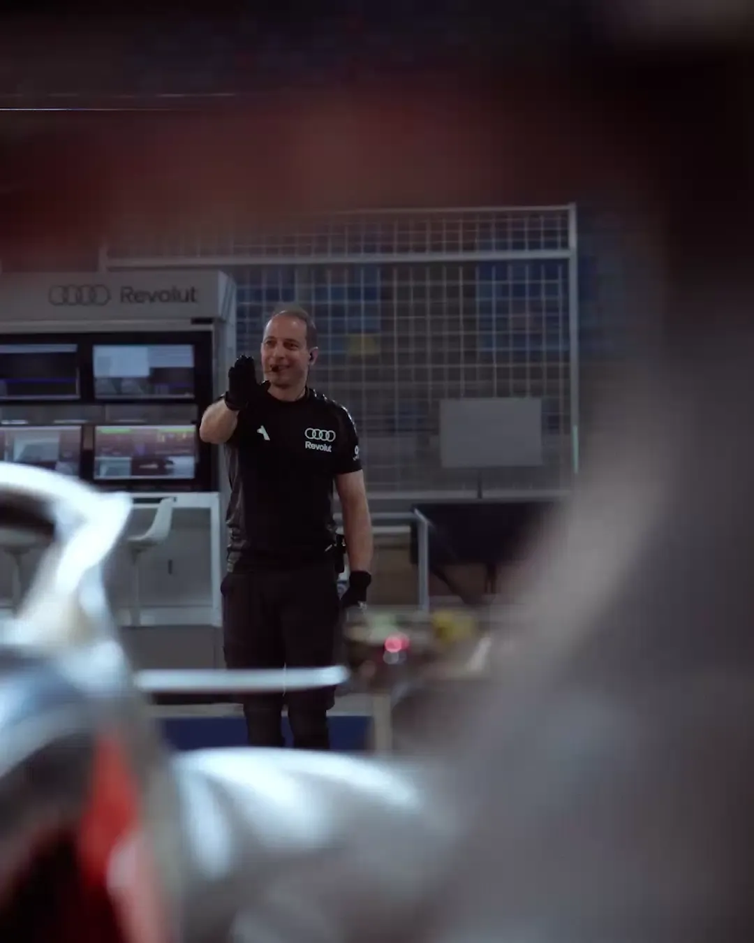 Audi Revolut F1® car bahrain2026 crewmember on the track leading, car testing