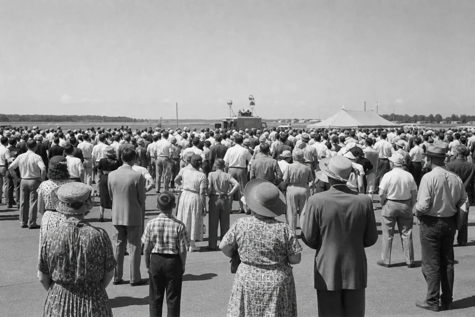 Historic Austrian Grand Prix race at Zeltweg Air Base with people gathering together at the racetrack