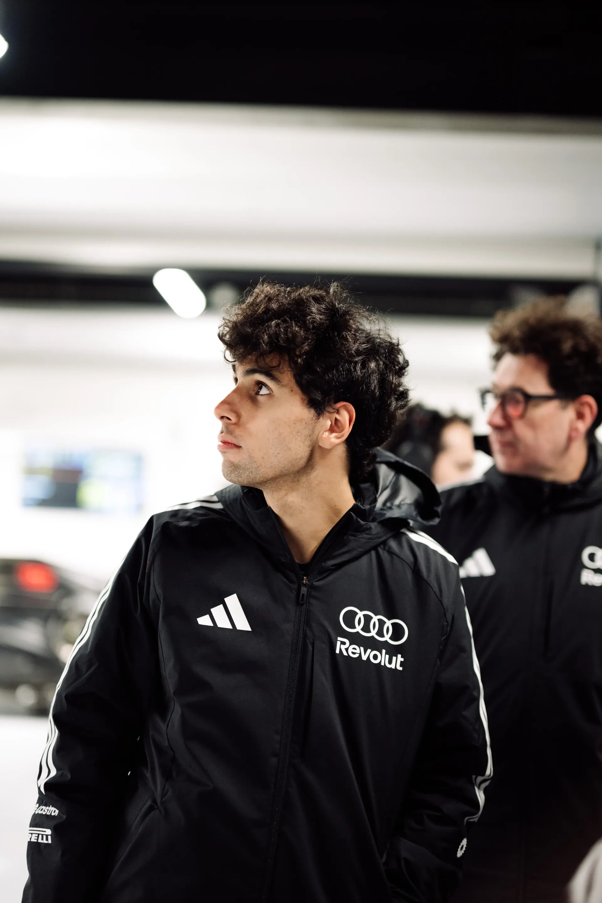 Closeup of Gabriel Bortoleto at garage of Pre-Season Testweeks: Bahrain Audi Revolut F1® Team