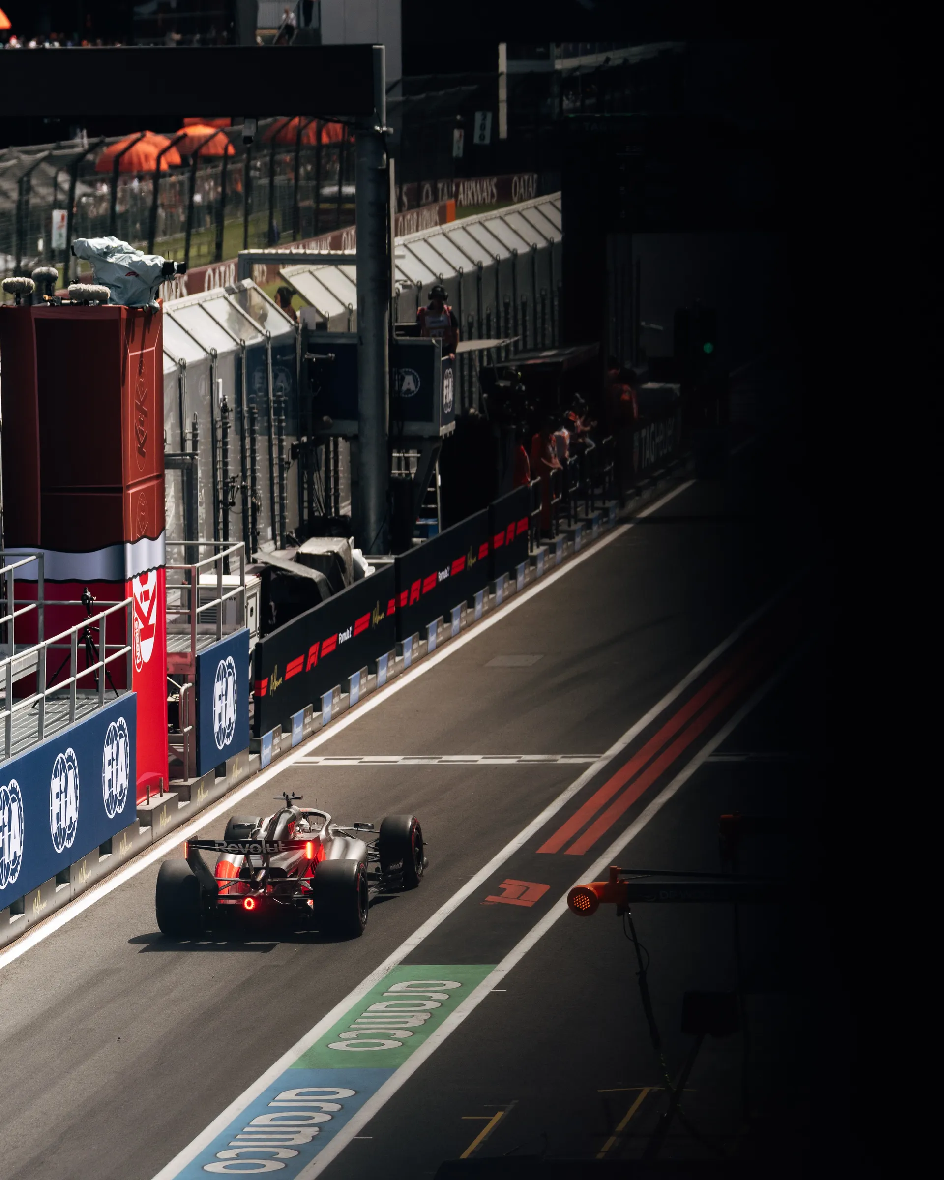 An Audi Revolut F1® Team car exits the pit lane at speed during qualifying in Melbourne.