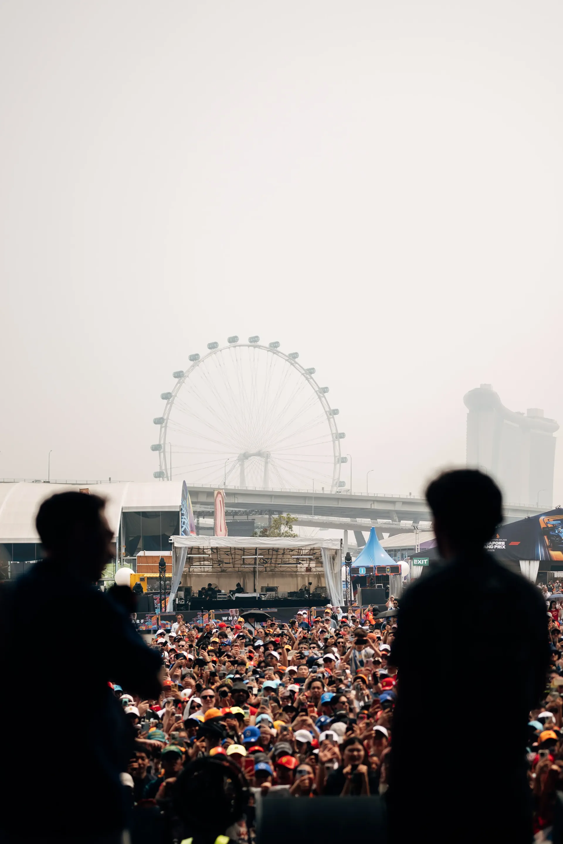 Fans gather beneath the Singapore Flyer during the Singapore Grand Prix, viewed from the event venue.
